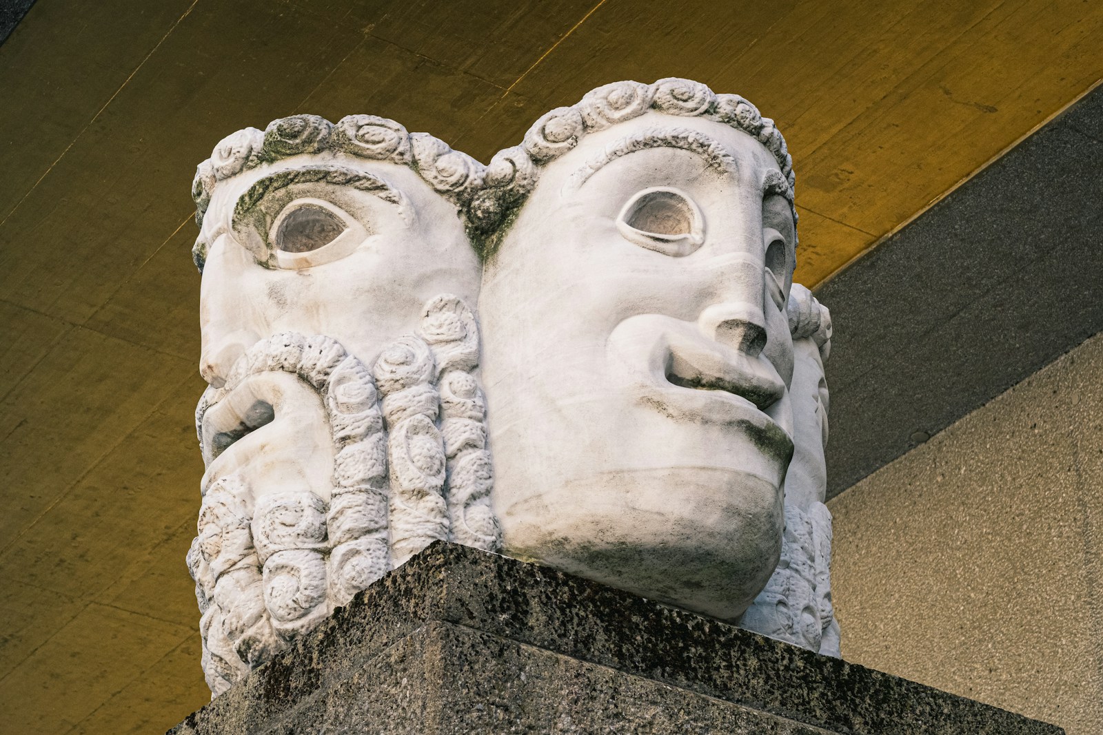 a stone sculpture of a man and a woman